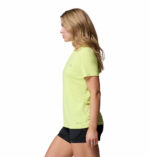 a woman wearing a yellow endless trail running tech tee