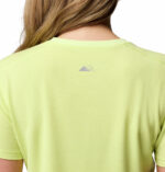 a woman wearing a yellow endless trail running tech tee