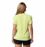 a woman wearing a yellow endless trail running tech tee
