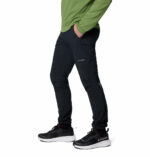 a man wearing black triple canyon II pants