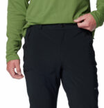 a man wearing black triple canyon II pants