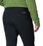a man wearing black triple canyon II pants