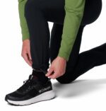a man wearing black triple canyon II pants
