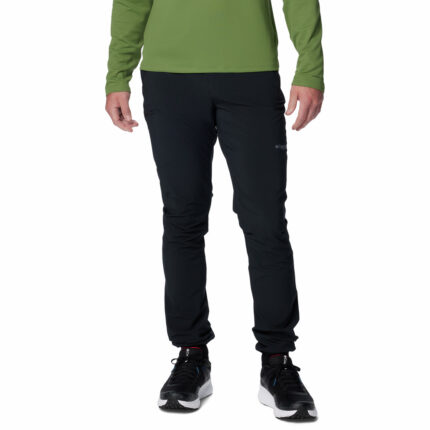 a man wearing black triple canyon II pants
