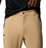 a man wearing brown triple canyon II convertible pants