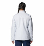 a women wearing a grey kruser ridge III softshell jacket