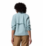 a women wearing a blue brea falls woven long sleeve shirt