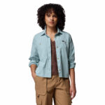 a women wearing a blue brea falls woven long sleeve shirt