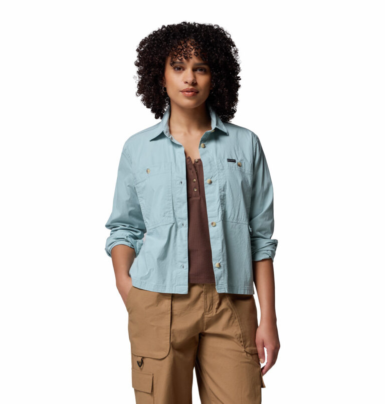 a women wearing a blue brea falls woven long sleeve shirt