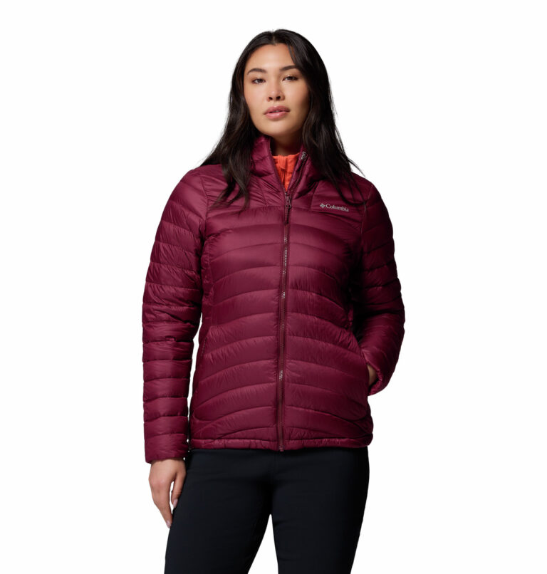 a women wearing a red corelite down hooded jacket