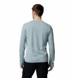 a man wearing a blue tech trail utility warm long sleeve crew shirt