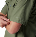 a man wearing a brown Bahama II Short Sleeve Shirt