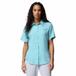 a women wearing a blue Tamiami II Short Sleeve Shirt