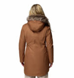 a women wearing a brown Suttle Mountain Long Insulated Jacket