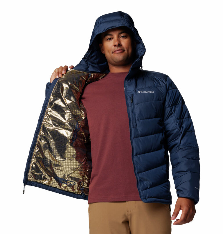 a man wearing a blue Labyrinth Loop II Hooded Jacket