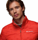 a man wearing a orange Delta Ridge II Down Jacket