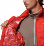 a man wearing a orange Delta Ridge II Down Jacket