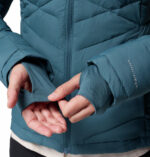 a women wearing a blue Joy Peak II Hooded Jacket