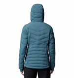 a women wearing a blue Joy Peak II Hooded Jacket
