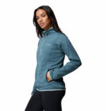 a women wearing a blue Essential Hike Gred Full Zip Fleece Jacket