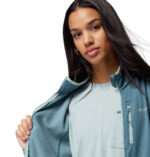 a women wearing a blue Essential Hike Gred Full Zip Fleece Jacket