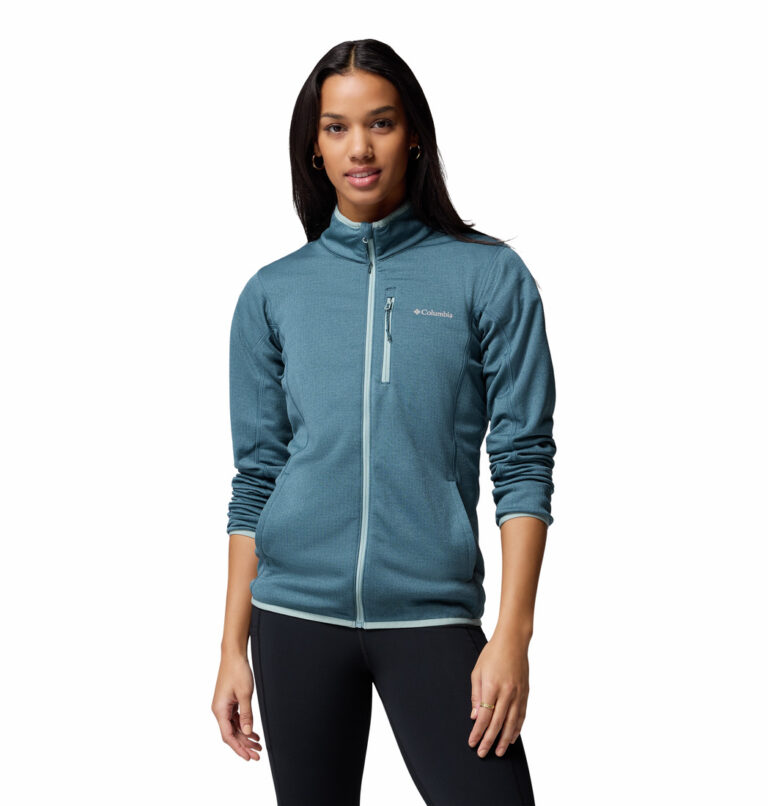 a women wearing a blue Essential Hike Gred Full Zip Fleece Jacket