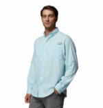 a man wearing a blue PFG Tamiami Long Sleeve Shirt