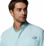 a man wearing a blue PFG Tamiami Long Sleeve Shirt