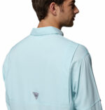 a man wearing a blue PFG Tamiami Long Sleeve Shirt