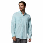 a man wearing a blue PFG Tamiami Long Sleeve Shirt