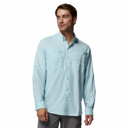a man wearing a blue PFG Tamiami Long Sleeve Shirt