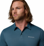 a man wearing a blue Columbia Hike Polo Shirt