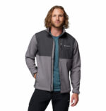 a man wearing a grey Ascender Softshell Jacket