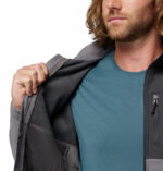 a man wearing a grey Ascender Softshell Jacket