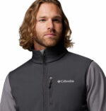a man wearing a grey Ascender Softshell Jacket