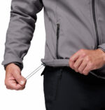 a man wearing a grey Ascender Softshell Jacket