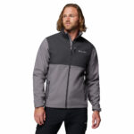 a man wearing a grey Ascender Softshell Jacket