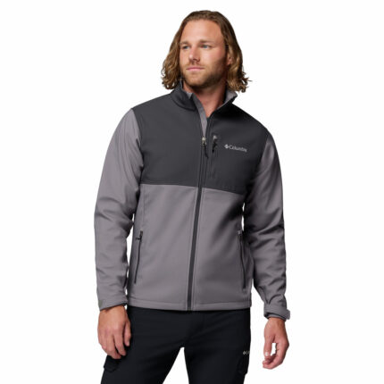 a man wearing a grey Ascender Softshell Jacket