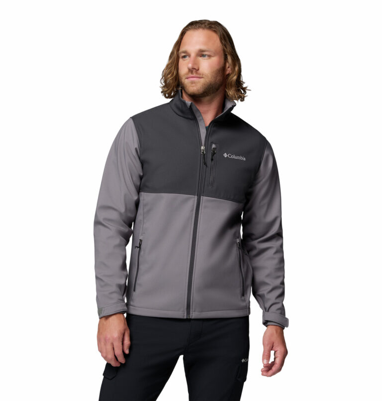 a man wearing a grey Ascender Softshell Jacket