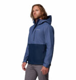 a man wearing a blue Hikebound II Jacket