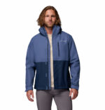 a man wearing a blue Hikebound II Jacket