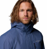 a man wearing a blue Hikebound II Jacket
