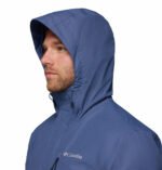 a man wearing a blue Hikebound II Jacket