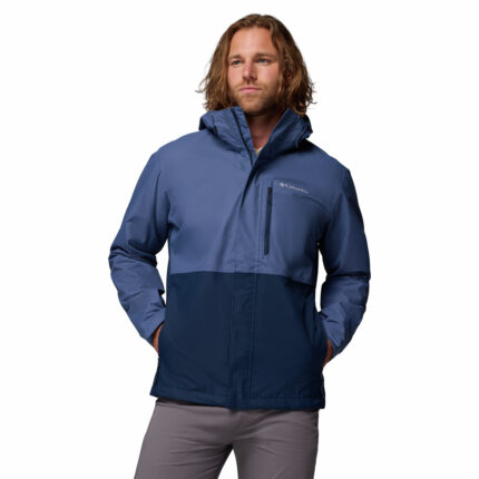 a man wearing a blue Hikebound II Jacket