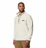 a man wearing a white Helvetia II Half Snap Fleece
