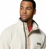 a man wearing a white Helvetia II Half Snap Fleece