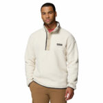 a man wearing a white Helvetia II Half Snap Fleece