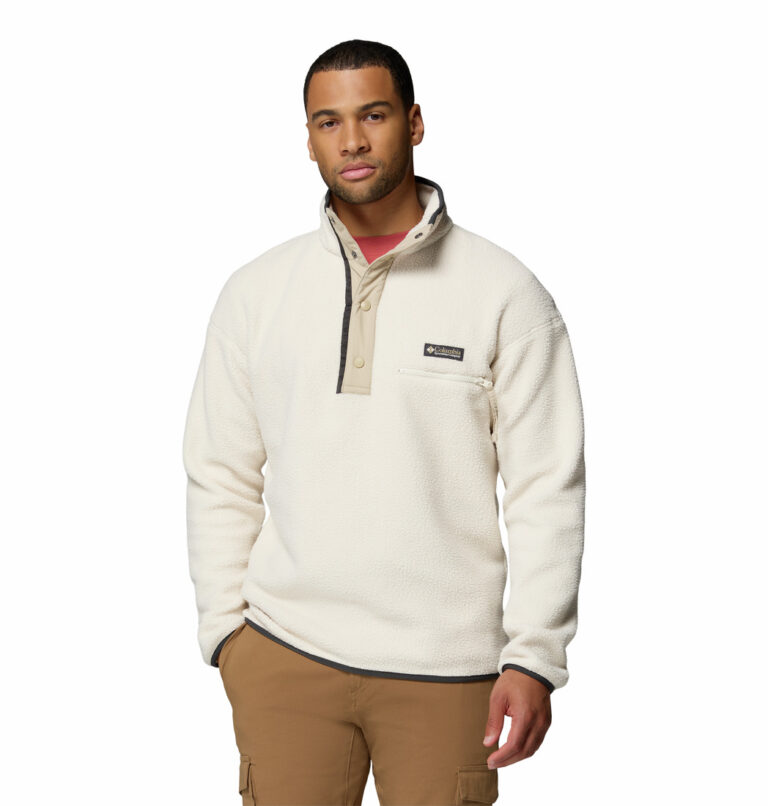 a man wearing a white Helvetia II Half Snap Fleece