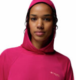 a women wearing a pink PFG Tidal Tee II Hoodie
