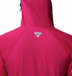 a women wearing a pink PFG Tidal Tee II Hoodie